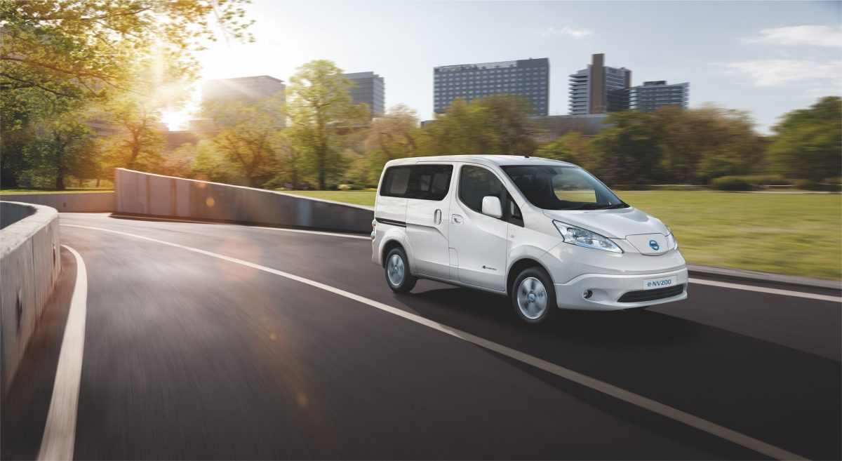New Nissan e-NV200 Evalia parked close to wind turbines and zero emission logo