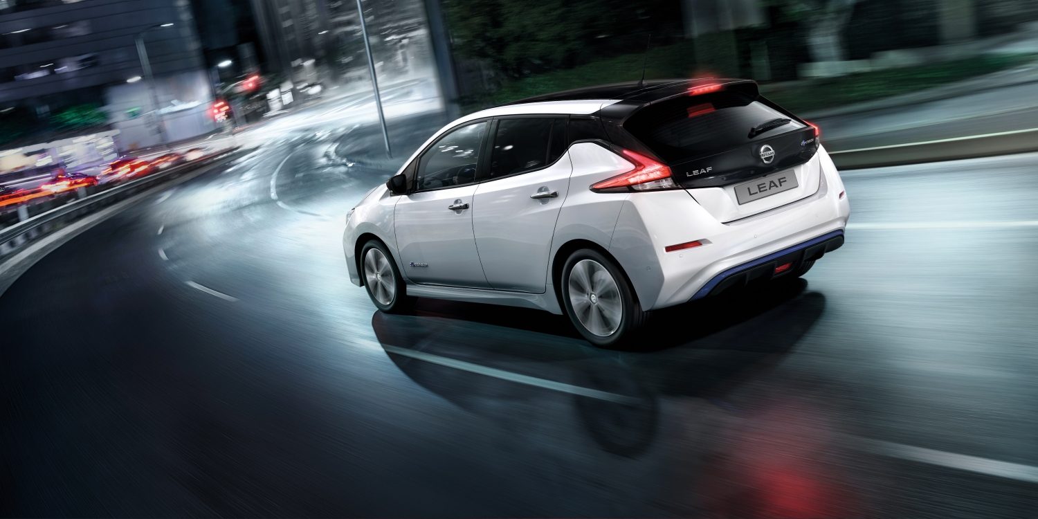 Nissan LEAF driving in a city at night