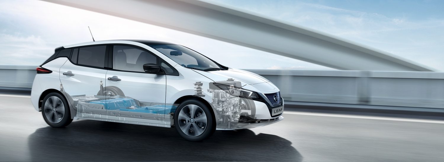 Nissan LEAF driving on a bridge with battery and motor showing