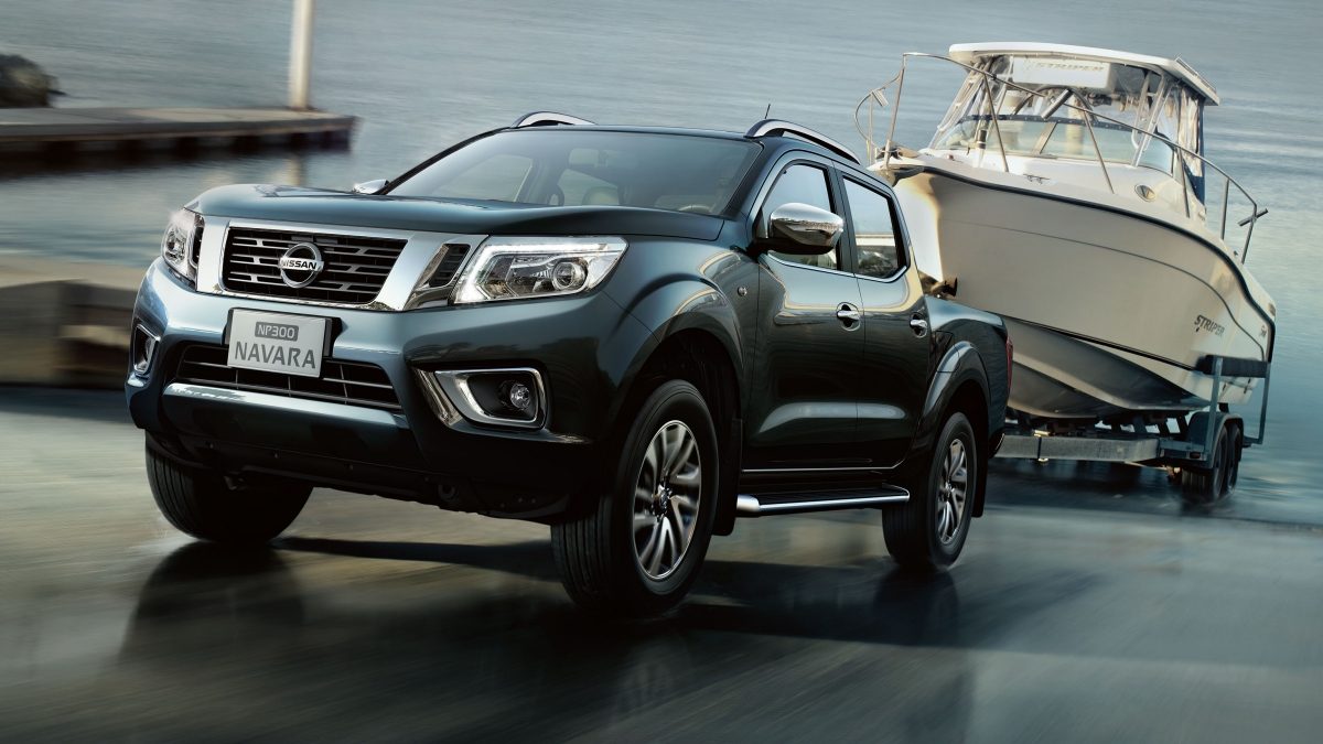 Front Angled Action Shot of Vehicle Towing Boat