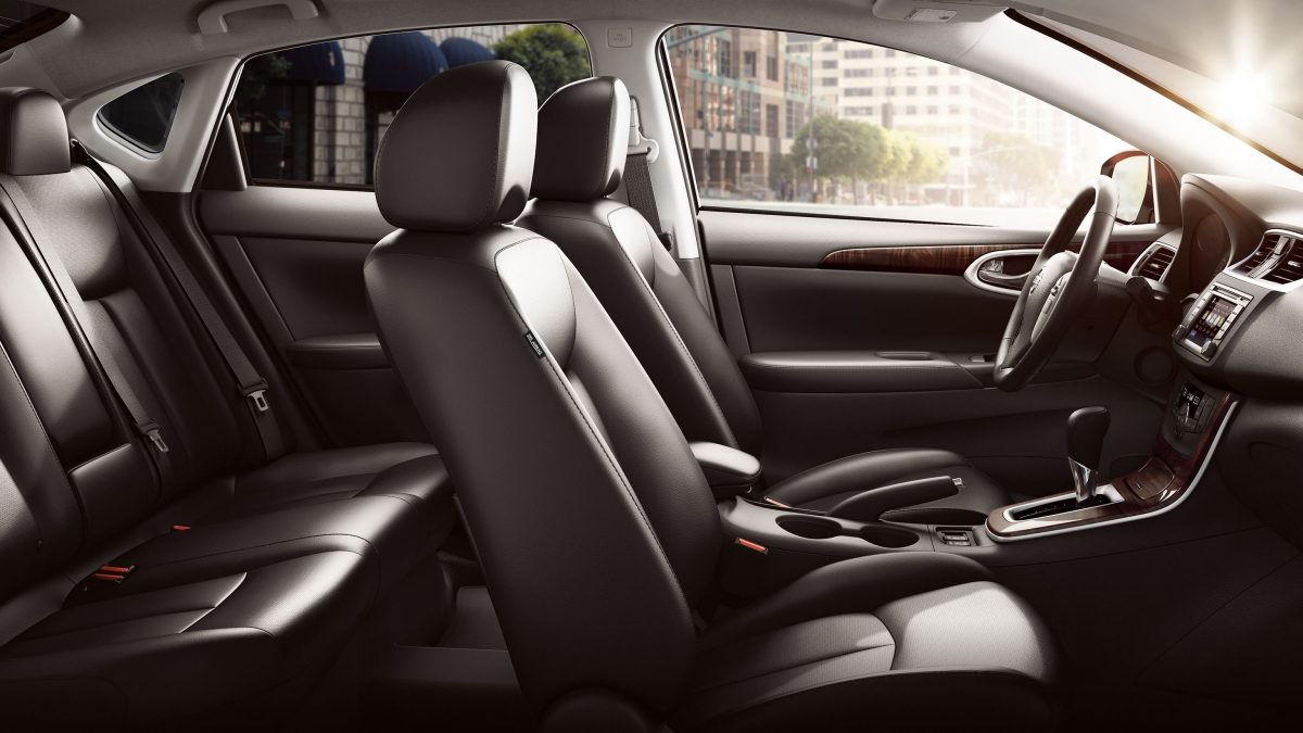Side view of Black seats & interior dashboard for Nissan Sentra