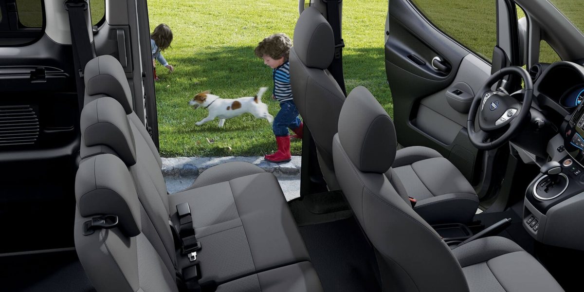 New Nissan e-NV200 Evalia interior view with children playing around the car