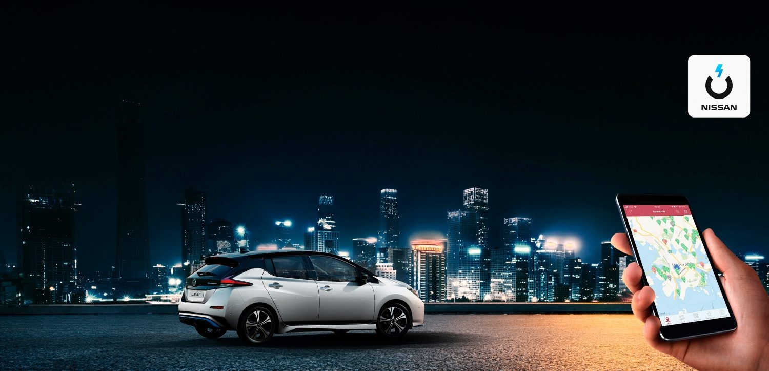 Nissan LEAF by night with a map on the phone on the bottom right and Nissan Charge Logo on the toop right