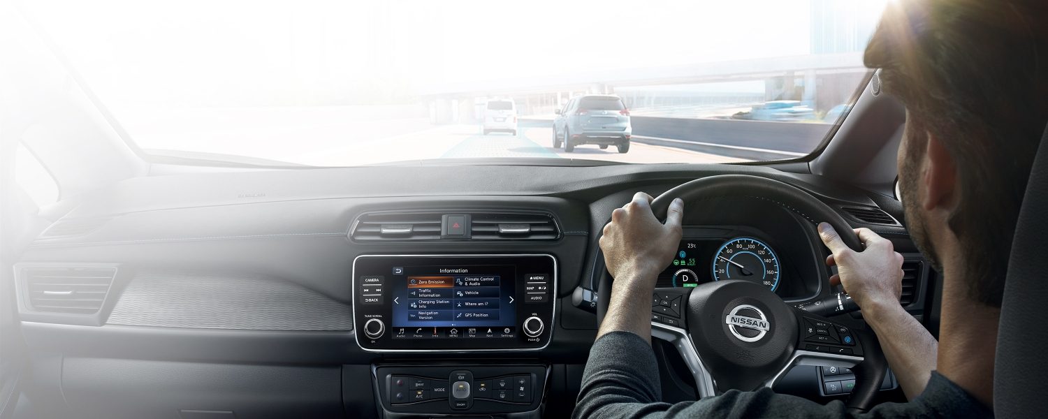 Rear interior view of a man driving a Nissan LEAF