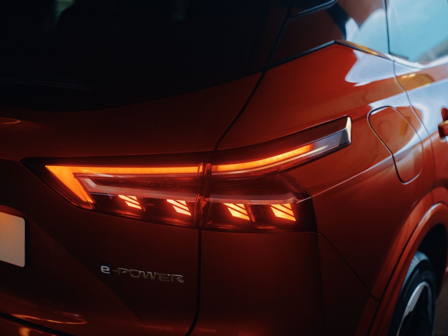 Nissan Qashqai e-Power interior side view with man looking inside through the window