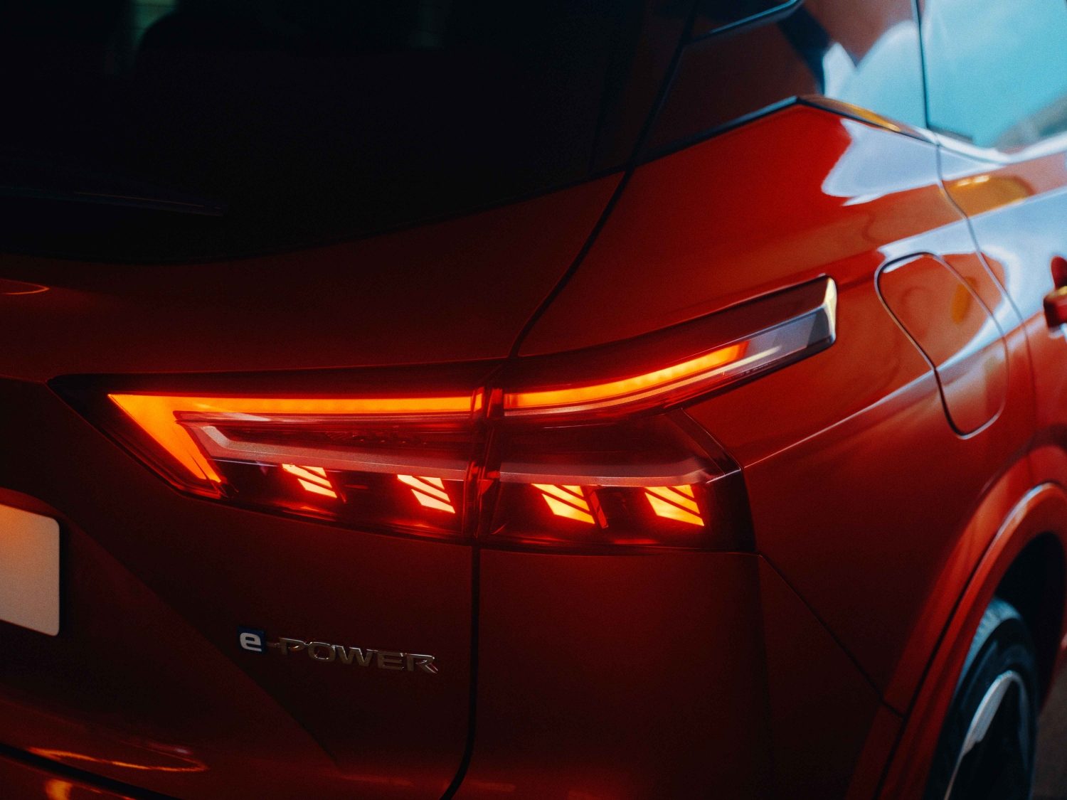 Nissan Qashqai e-Power interior side view with man looking inside through the window