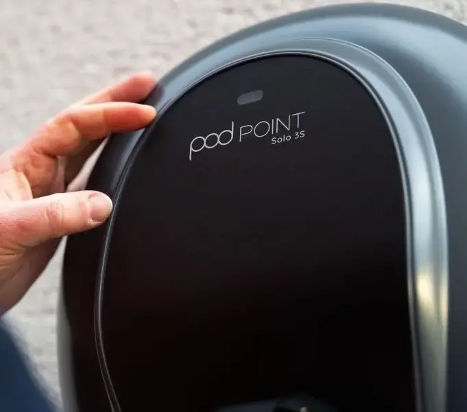A podpoint charger mounted on a wall