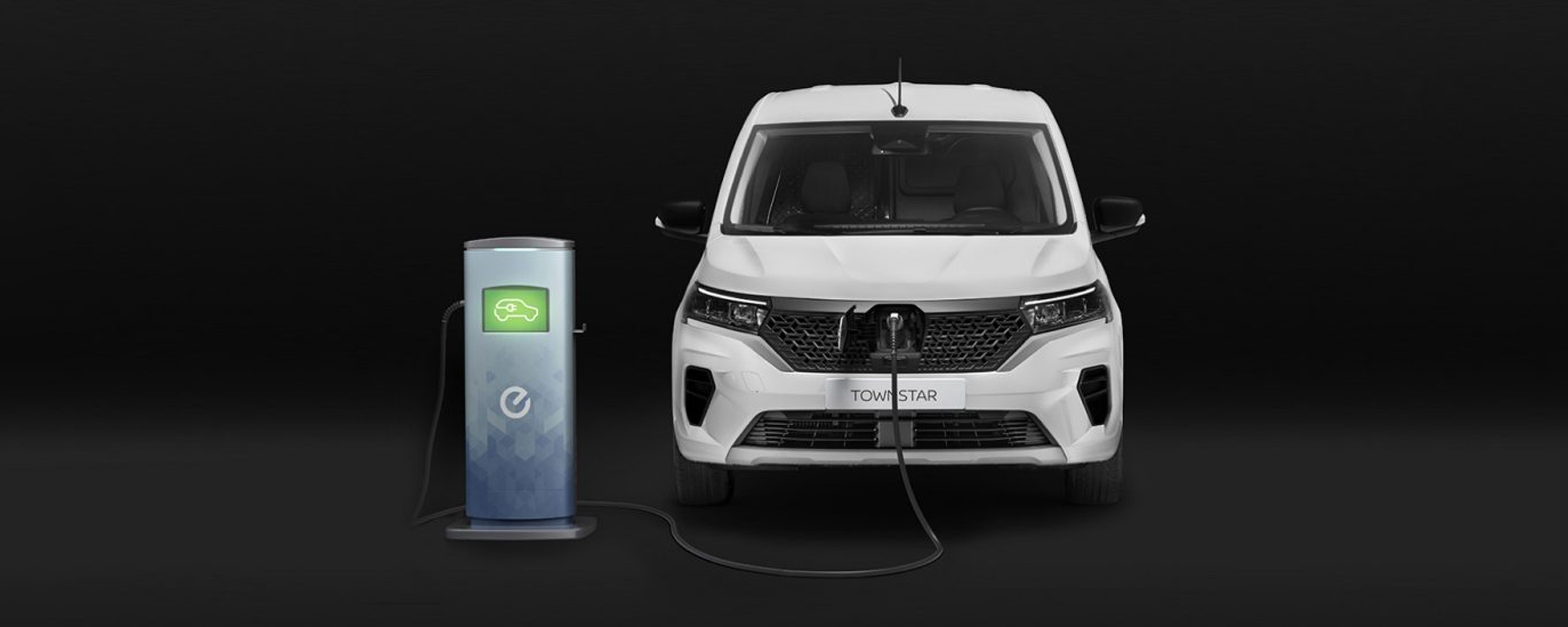 white nissan townstar EV plugged in to charger and charging