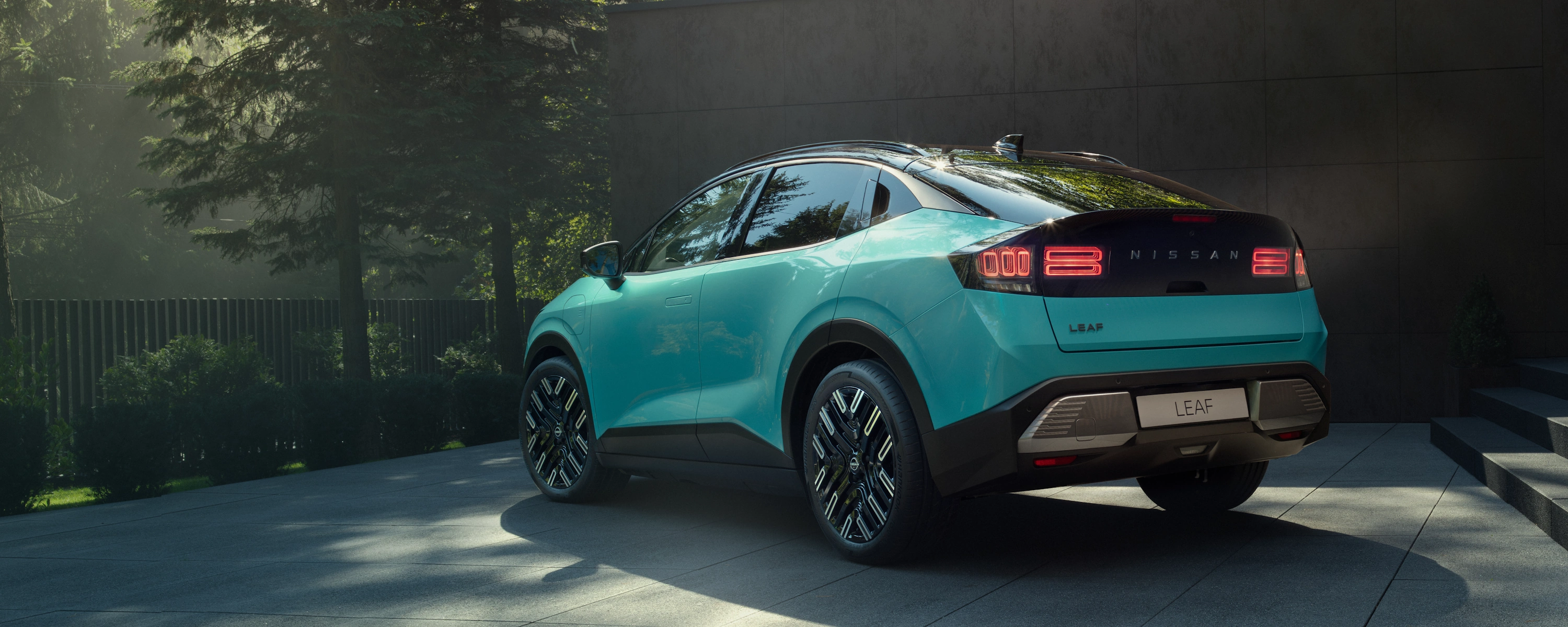 Nissan LEAF electric SUV parked on a coastal cliff-top road, Car of the Year 2026 