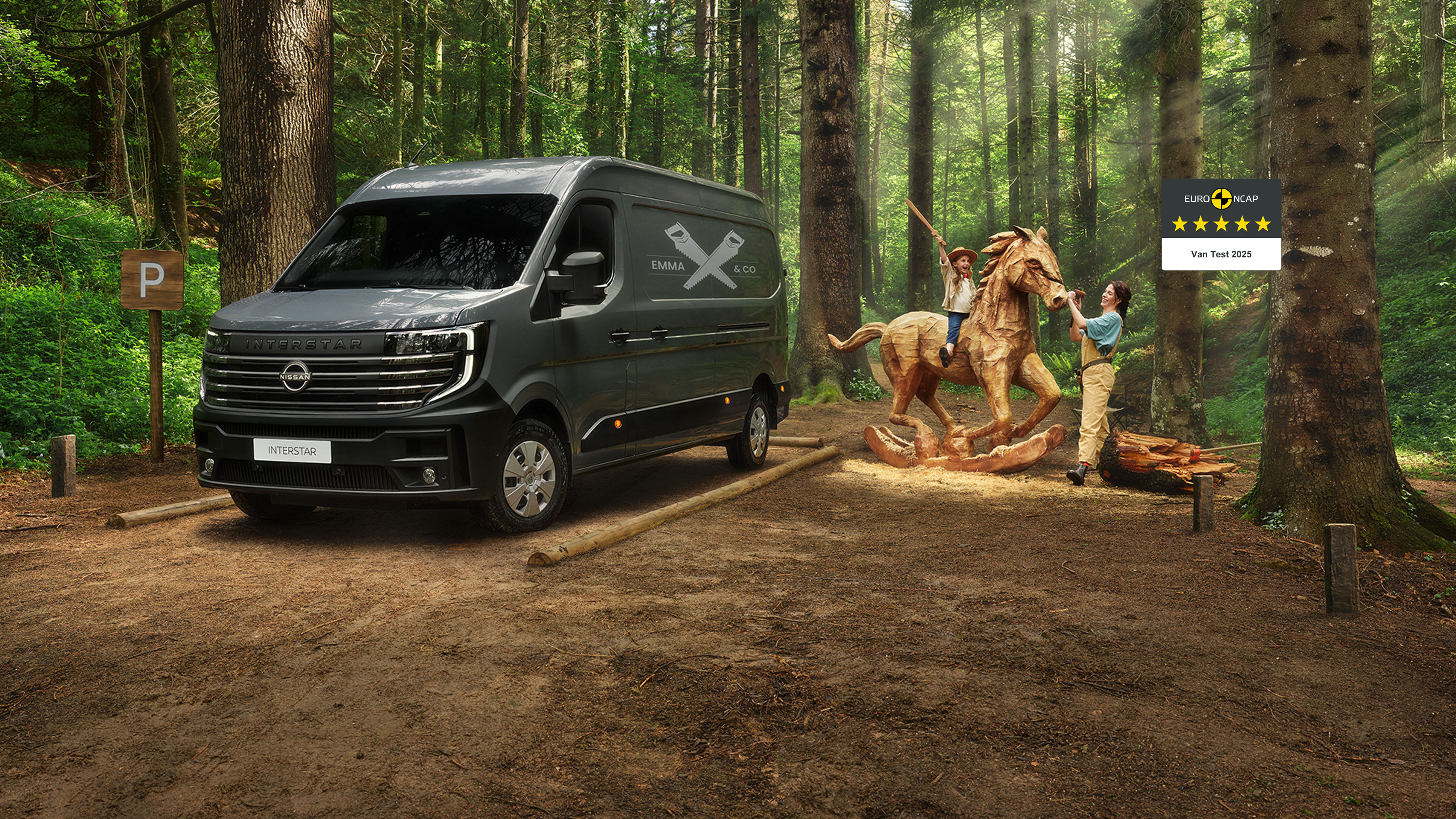 Nissan Interstar 3/4 front parked van in the woods with family playing around a wooden horse