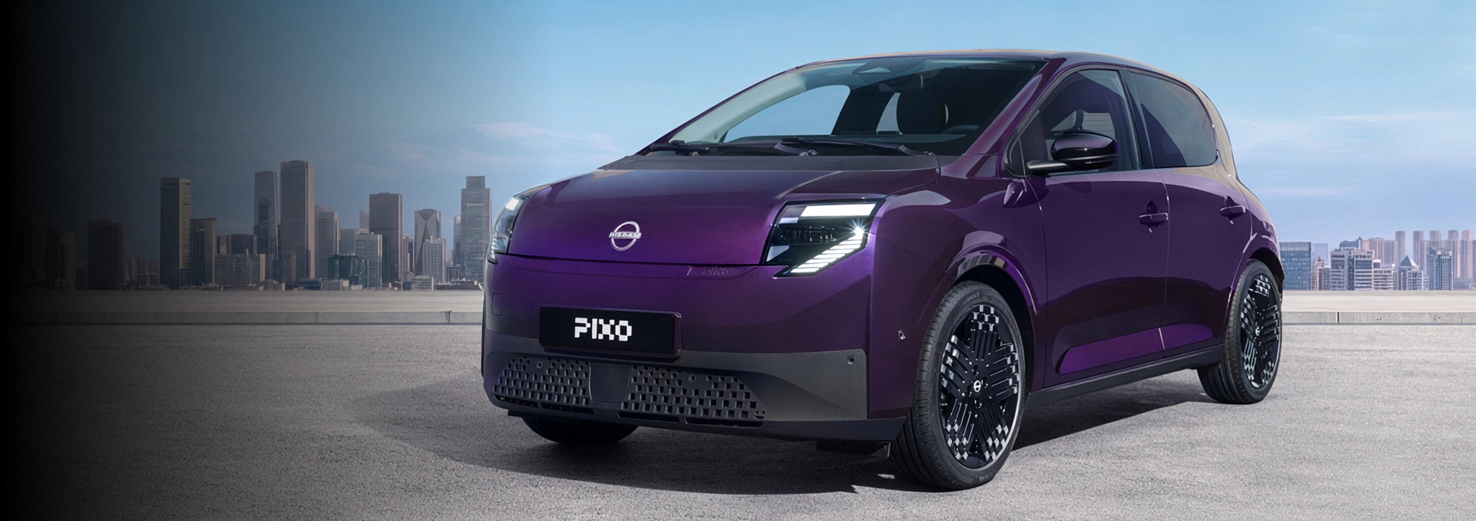 New Nissan PIXO overlooking a city in the background