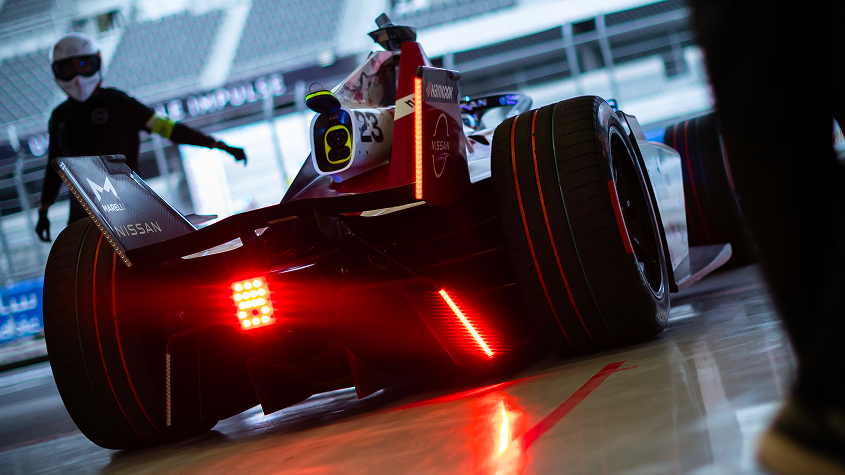 Nissan Formula E single-seater seen from the rear on the pit lane.