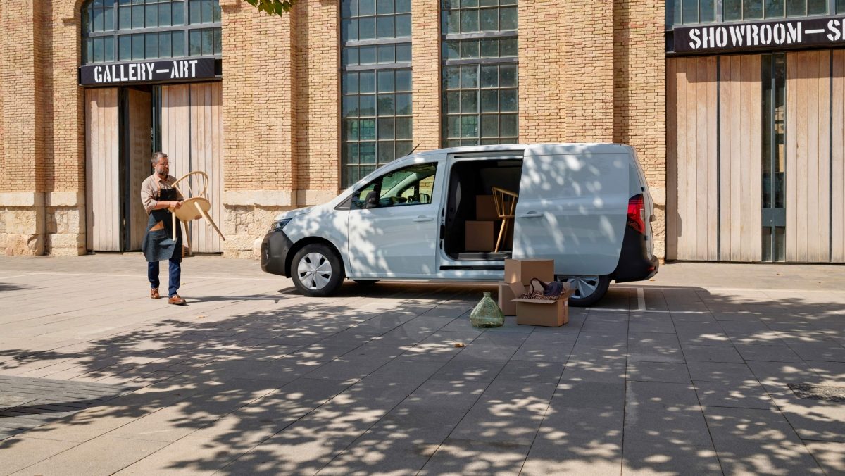 Nissan Towstar Van  -   man is loading a stationary  L2 vehicle