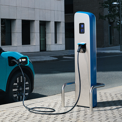 Nissan Leaf electric family car charging at station