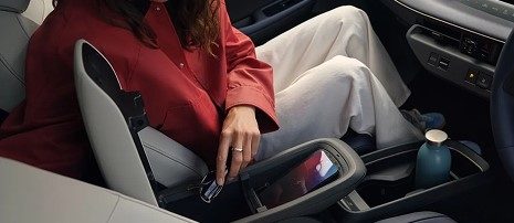 Passenger relaxing inside Nissan Leaf