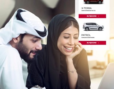 Man & Woman shopping NISSAN cars on laptop