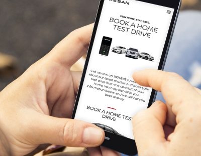 man ordering a test drive on a phone