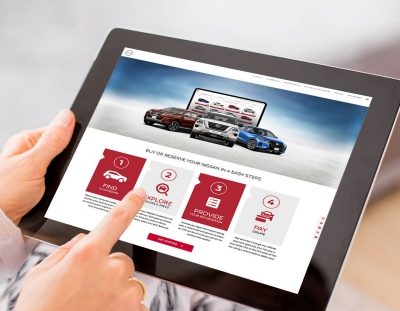 shopping NISSAN cars on tablet