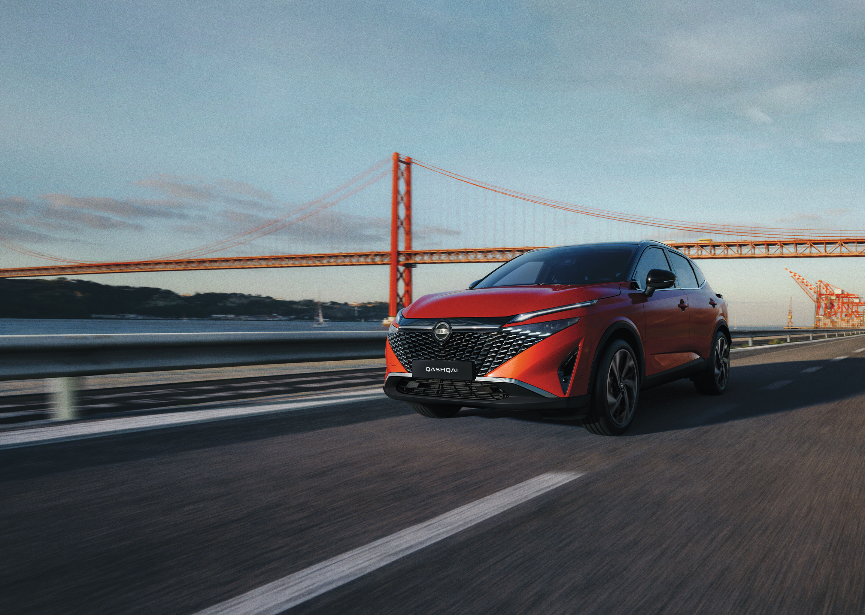 Nissan Qashqai e-Power full front static view with man leaning against the bonnet.