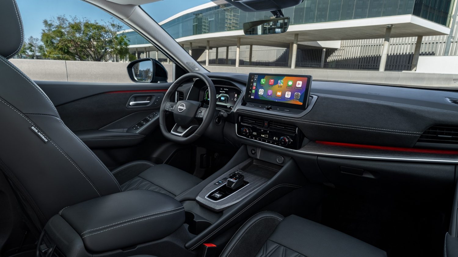 Nissan Qashqai e-Power interior side view with man looking inside through the window