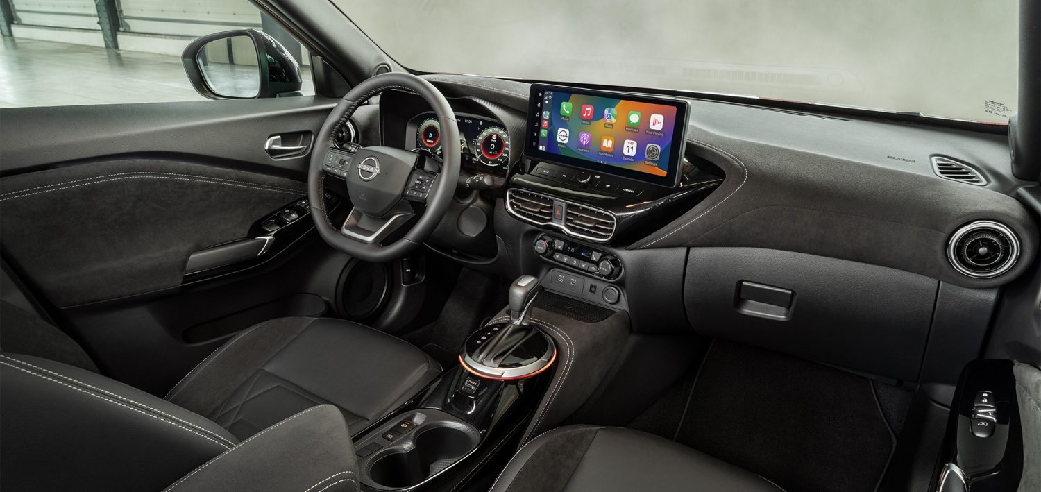 Nissan JUKE interior front view with passenger