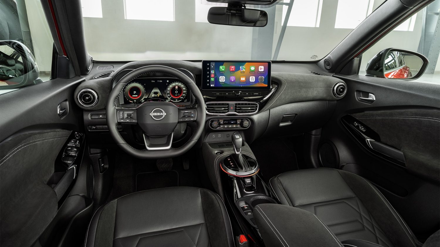 Nissan JUKE front interior view with driver