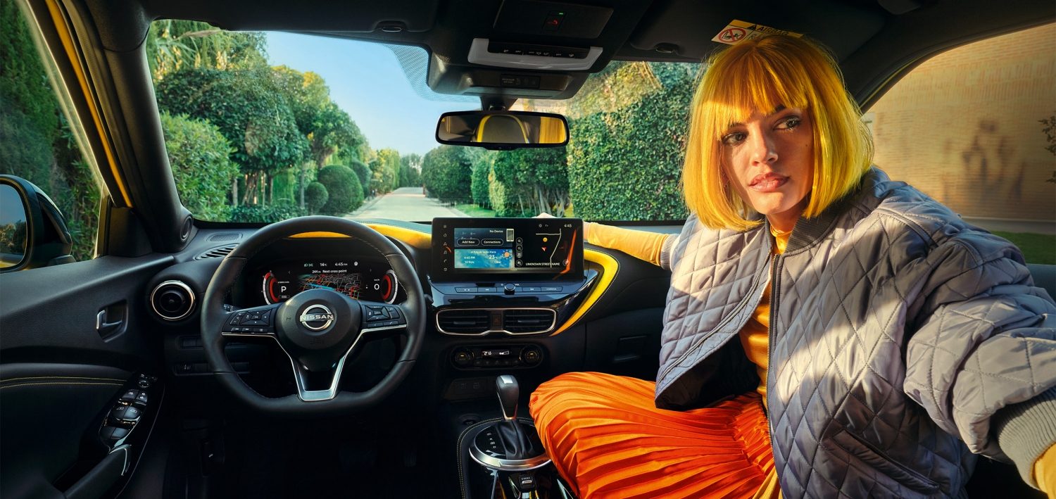 Nissan JUKE interior front view with passenger